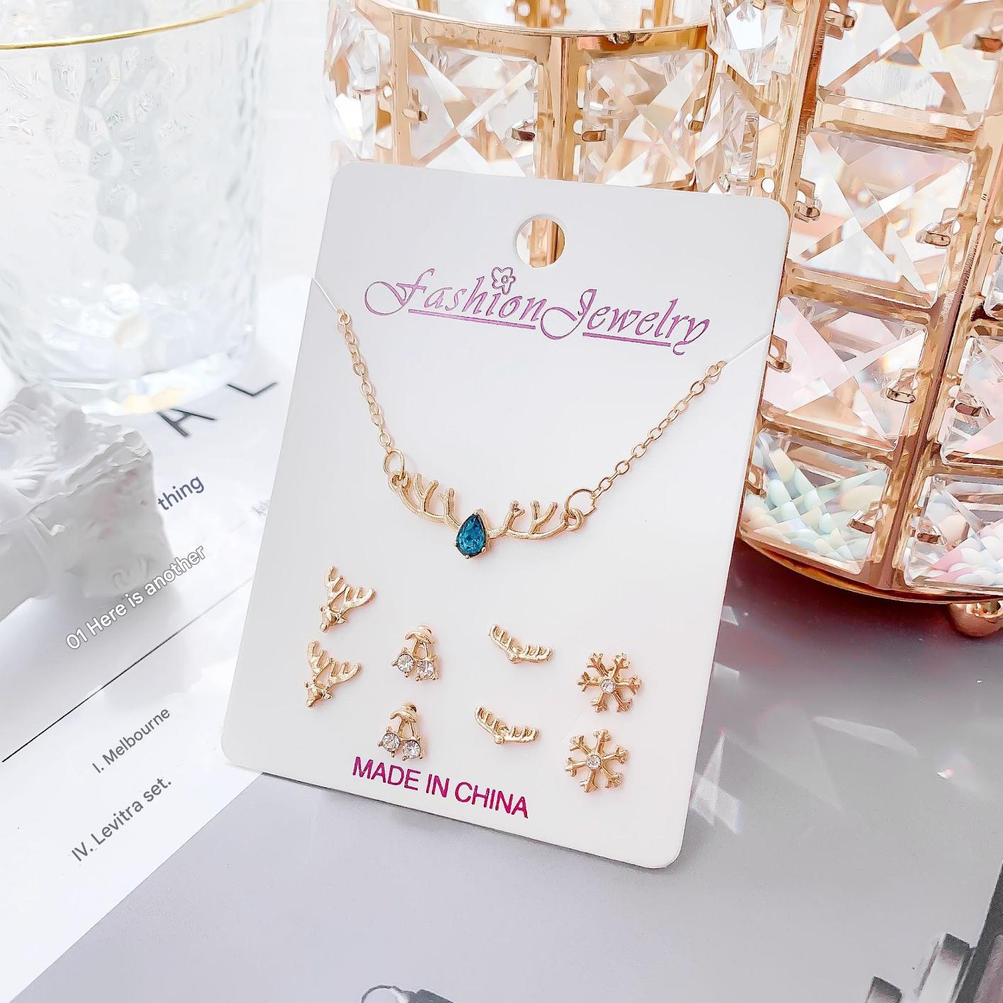 Gold crystal necklace with moon design