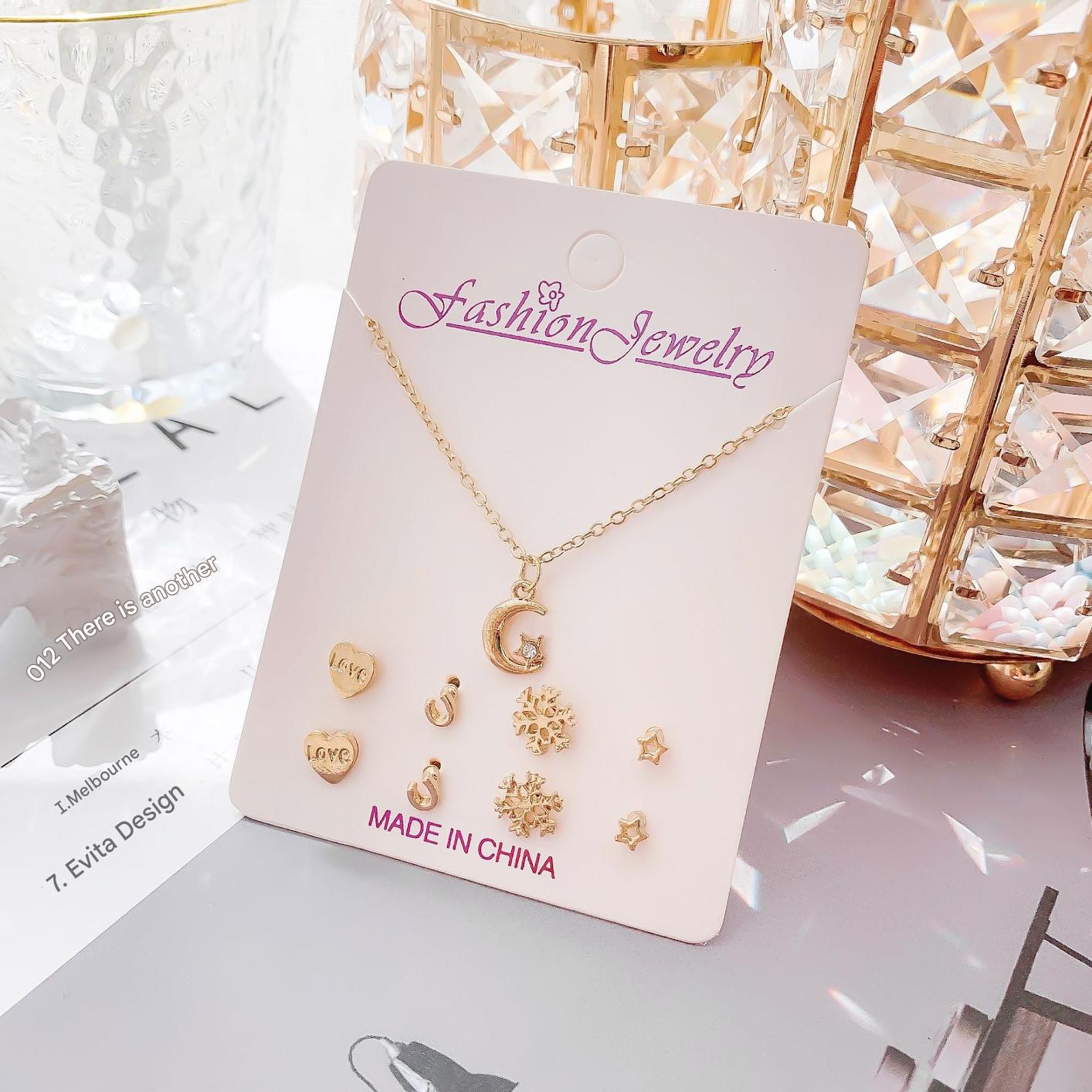 Gold crystal necklace with moon design