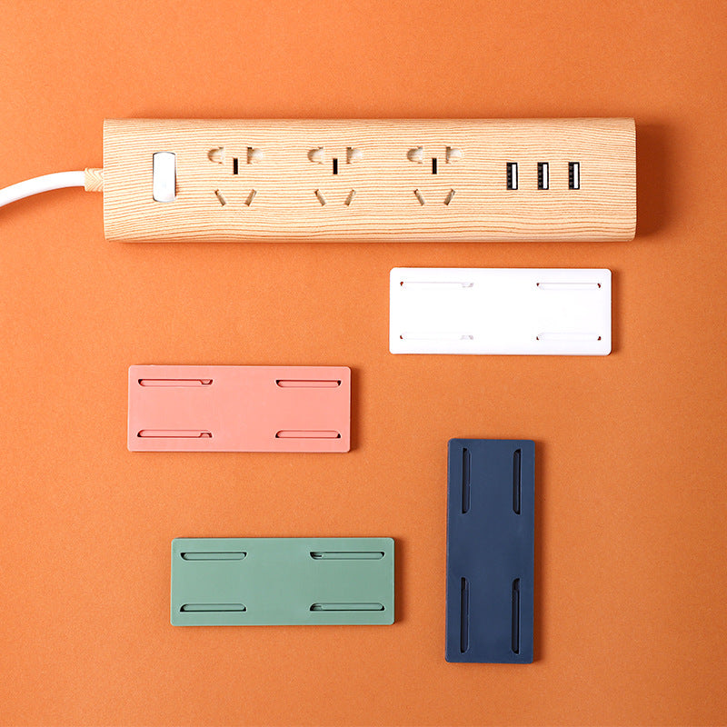 Wall-mounted power strip organizer in green