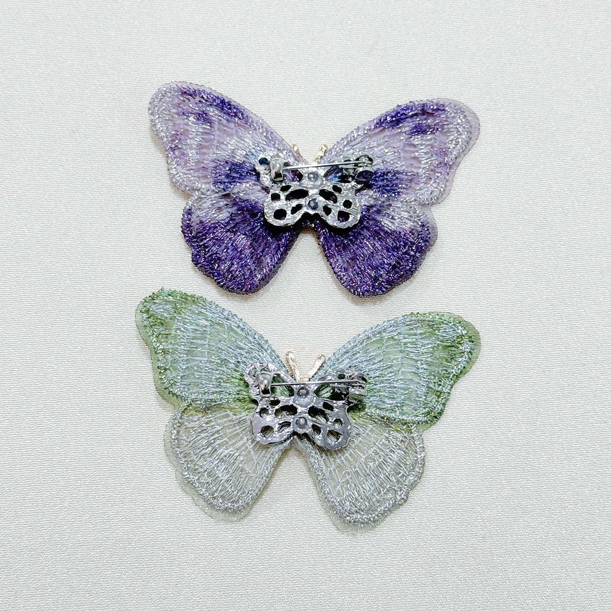 Embroidered butterfly brooch front view
