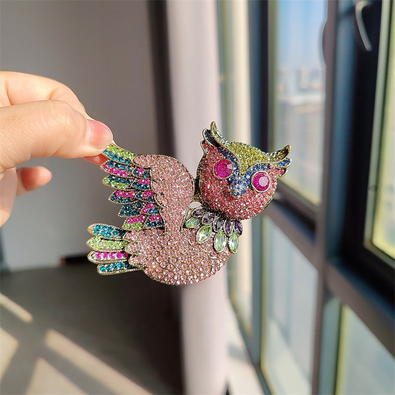 Owl brooch with rhinestones front view