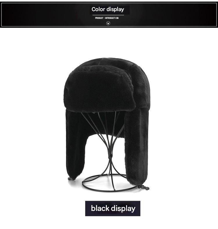 Stylish winter earflap hat on outdoor background