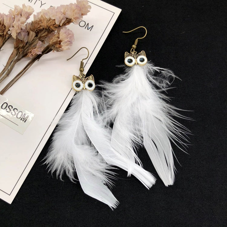 Vintage owl feather earrings close-up