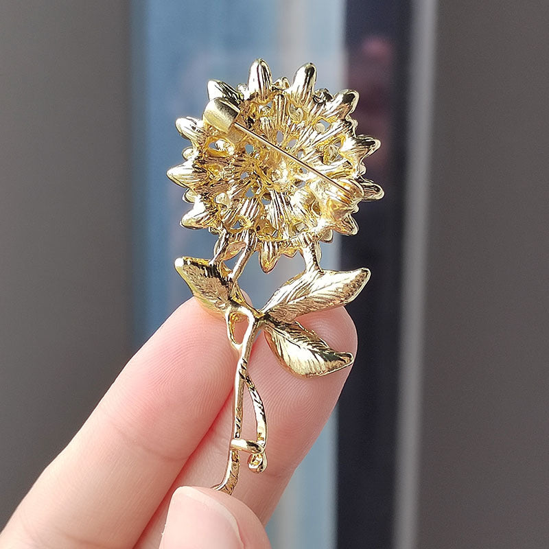 Stylish crystal wheat spike brooch on a jacket