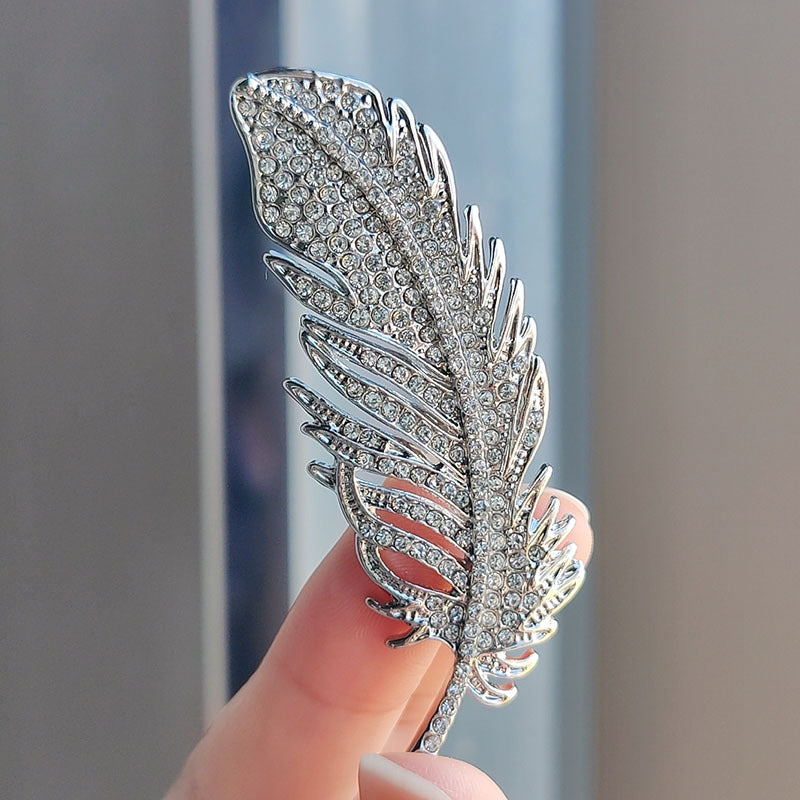 Close-up of rhinestone feather pin