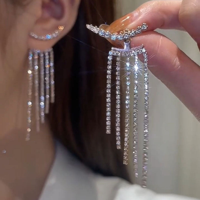Close-up of silver pin earrings - image 2
