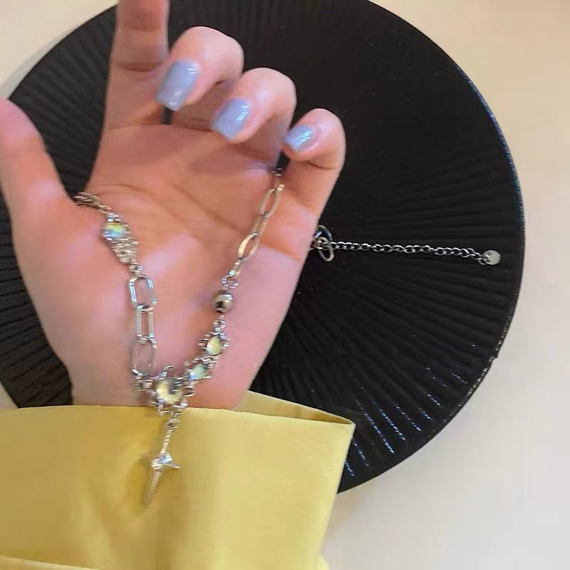 Elegant moonstone cross necklace on display
