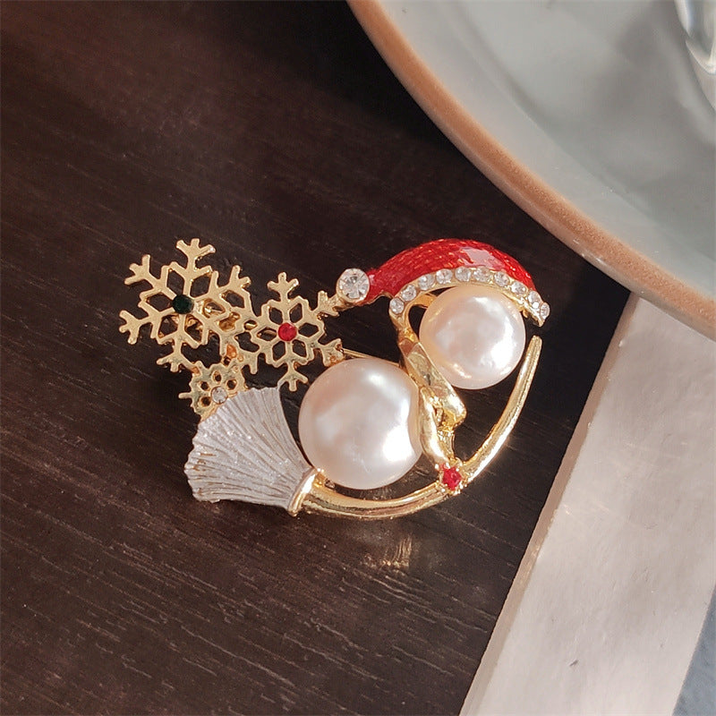 Snowman Brooch Styled on a Jacket