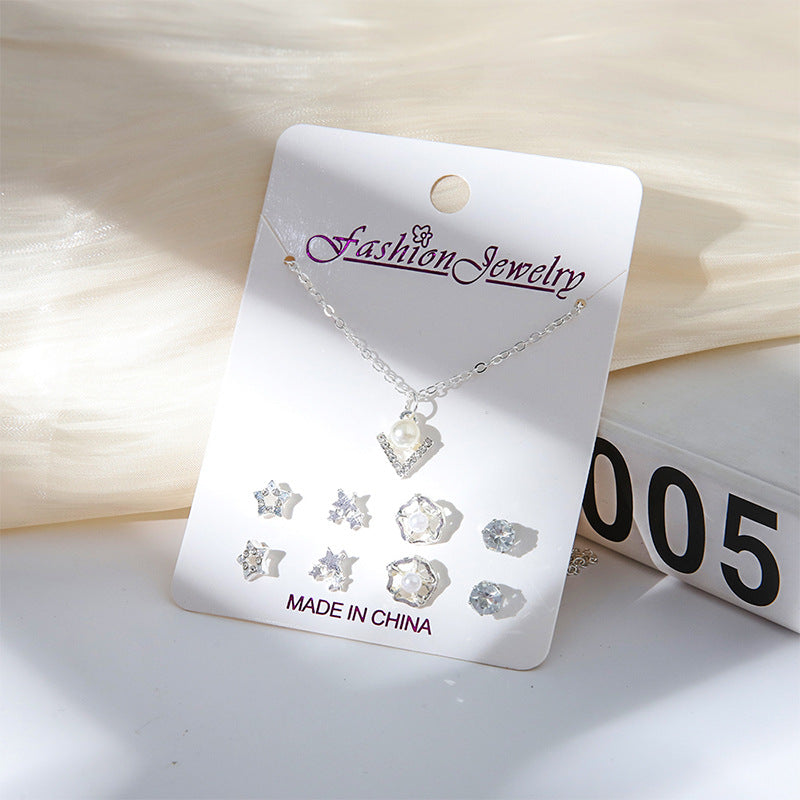 Gold crystal necklace with moon design