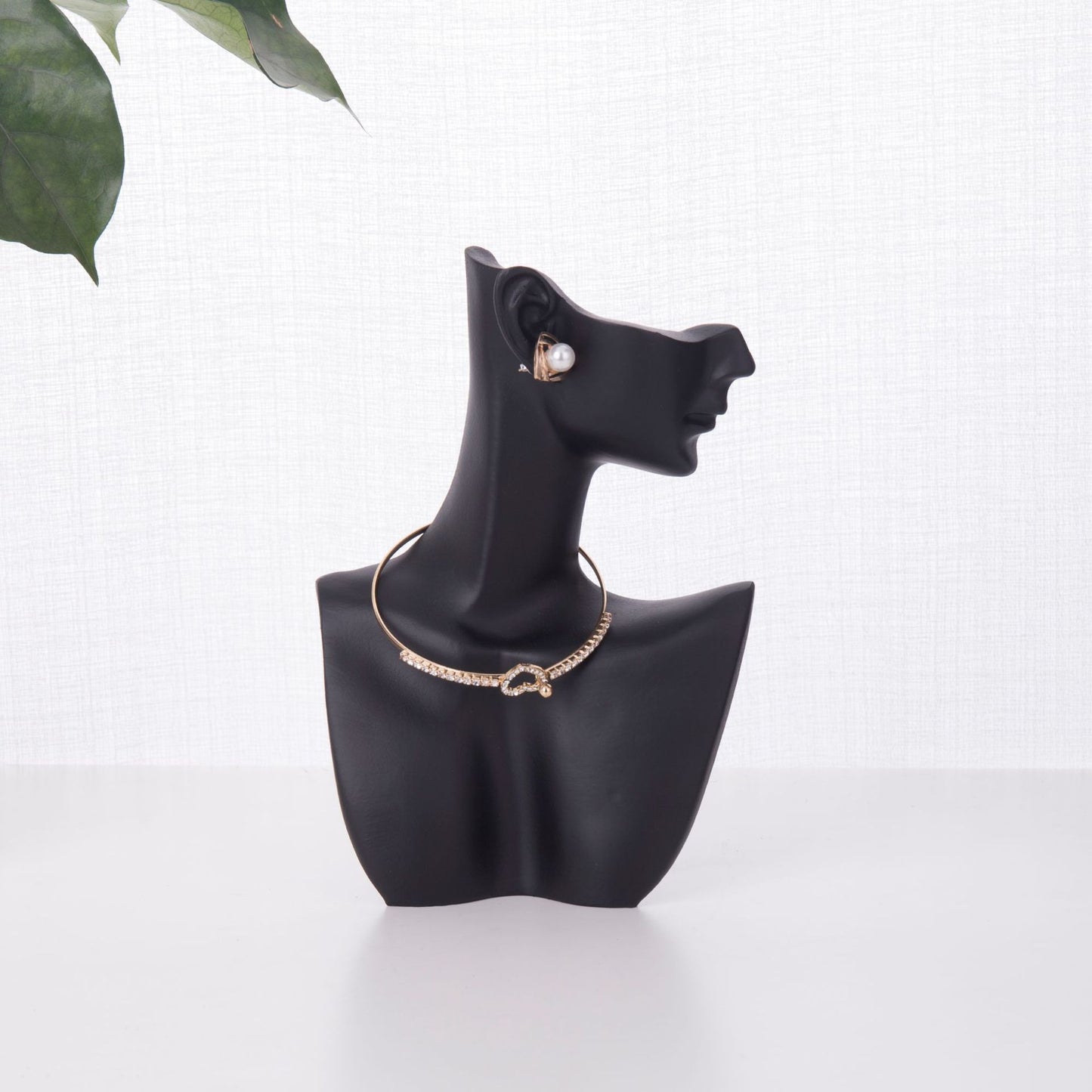 resin jewelry display stand in white storefront