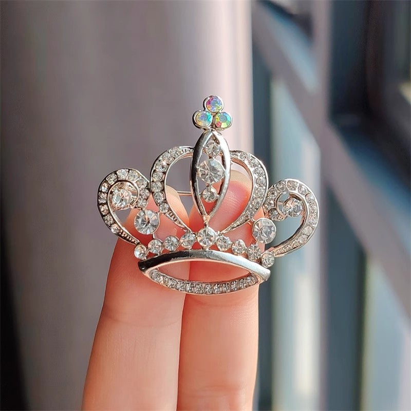 Gold crown brooch with rhinestones