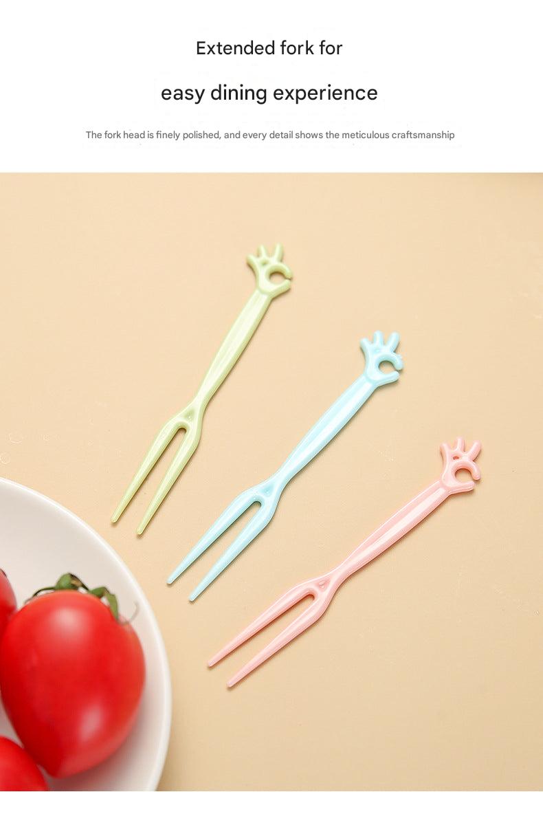 colorful disposable forks on a table with fruits
