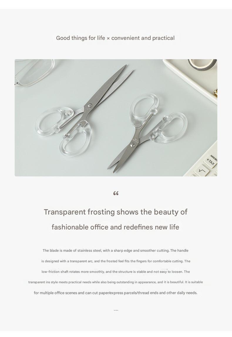 Scissors being used to cut paper during a project