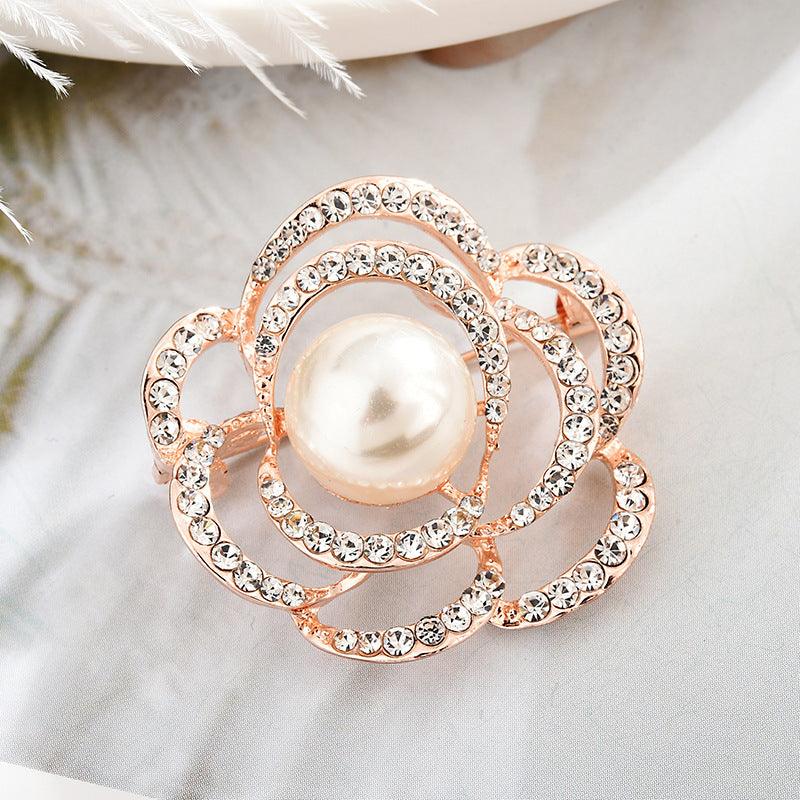 Rhinestone embellished brooch on a dress image 5