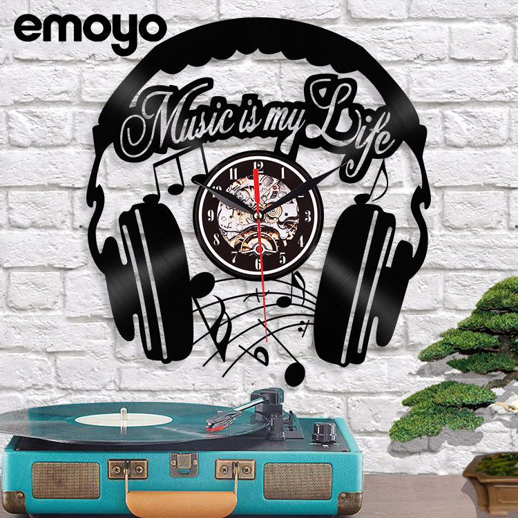 Stylish black vinyl wall clock with music design