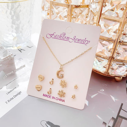 Gold crystal necklace with moon design