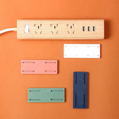 Wall-mounted power strip organizer in green
