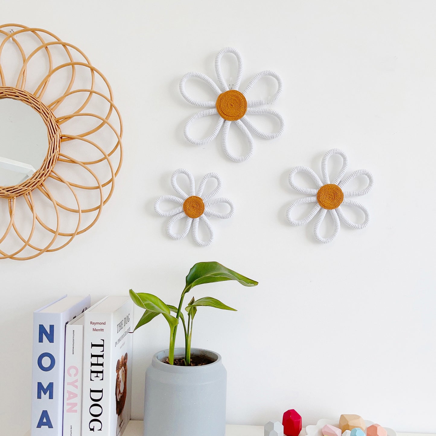 Colorful nursery wall decor with daisies