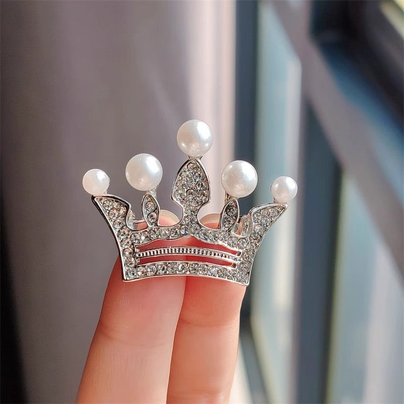 Gold crown brooch with rhinestones