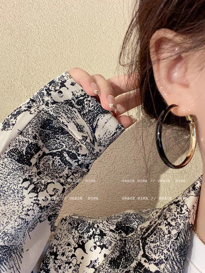 Fashionable oversized white circle earrings