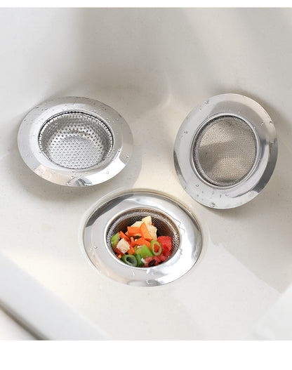 Kitchen sink with installed strainer preventing clogs