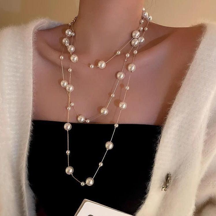 Pearl necklace showcased on jewelry stand