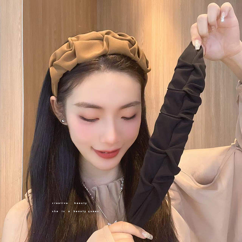 Stylish wrinkled wide hairband fabric close-up