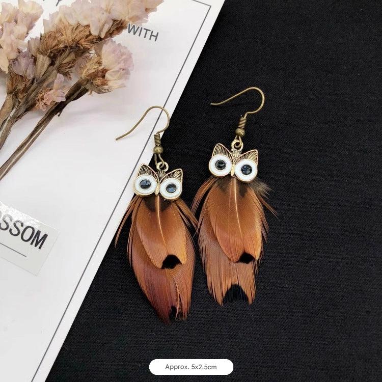 Vintage owl feather earrings close-up