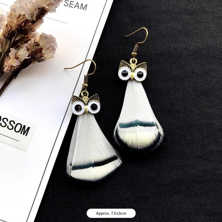 Vintage owl feather earrings close-up