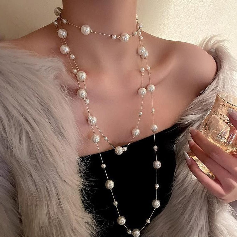 Worn long pearl necklace for fashionable look