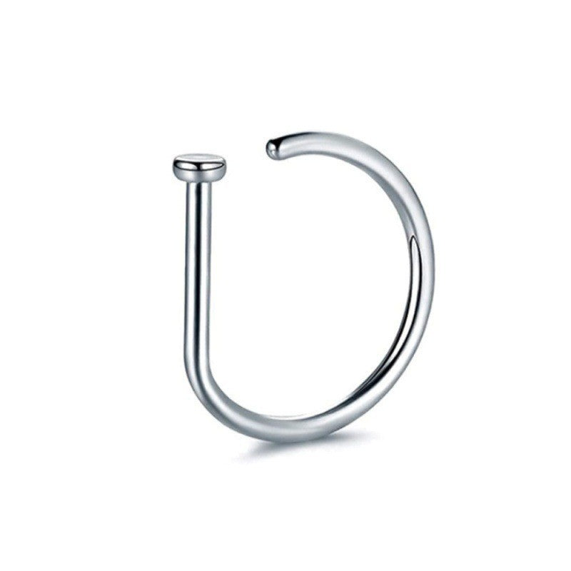 close-up of hip hop nose ring in gold color image 2