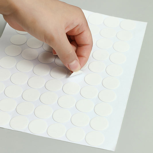 Close-up of reusable acrylic adhesive dots