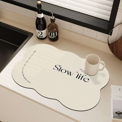 Diatomaceous countertop mat for splashes