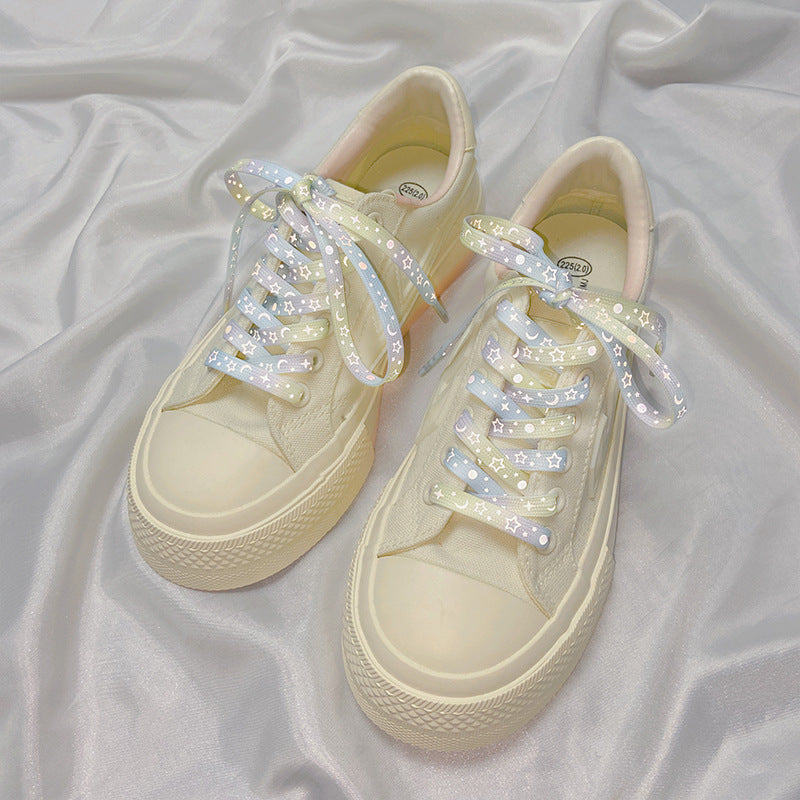 Mint green reflective shoelaces on a pair of shoes
