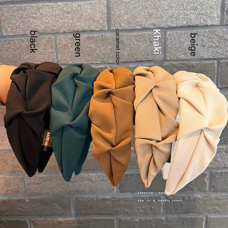 Stylish wrinkled wide hairband fabric close-up