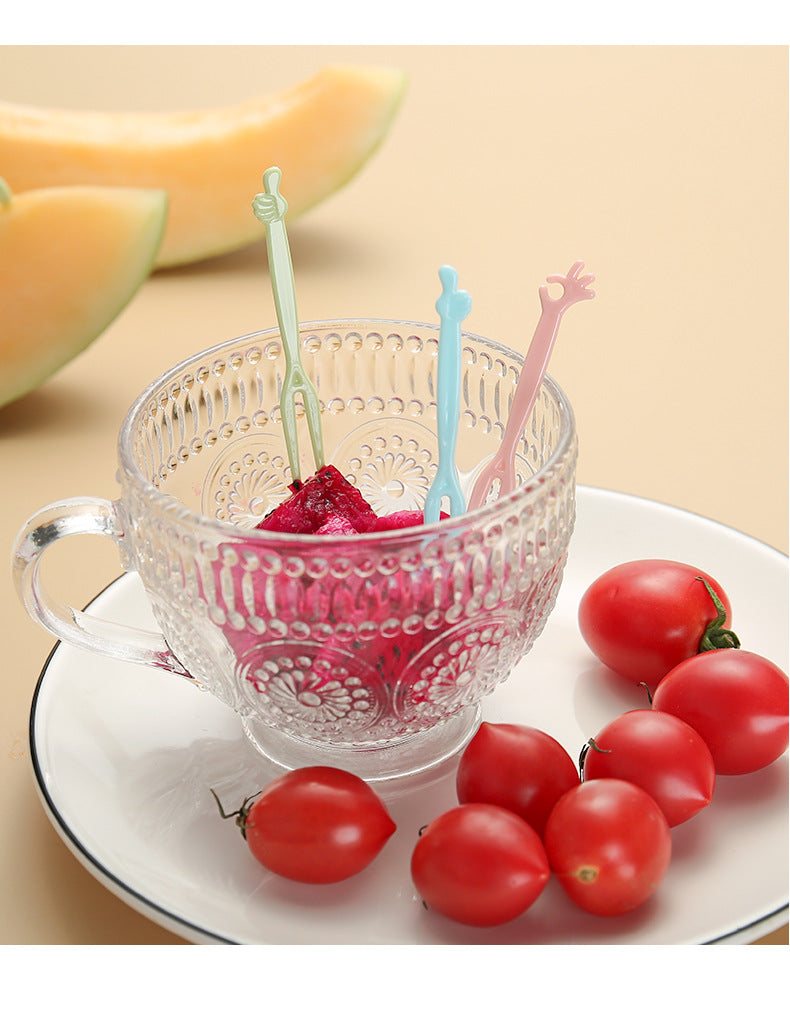 close up image of colorful disposable forks