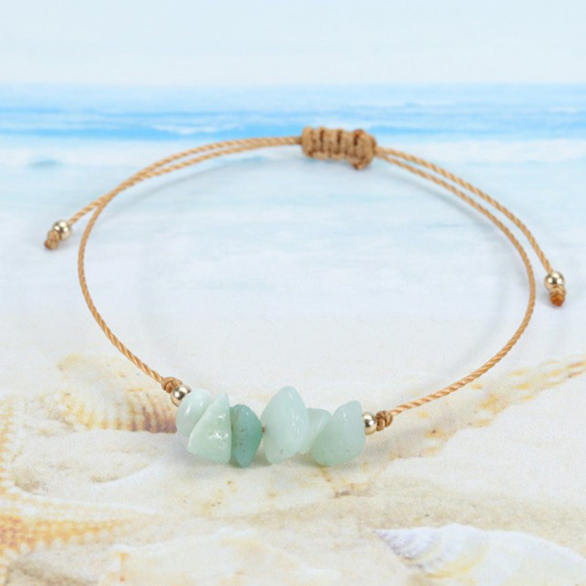 Handcrafted colorful crystal bracelet on a white background