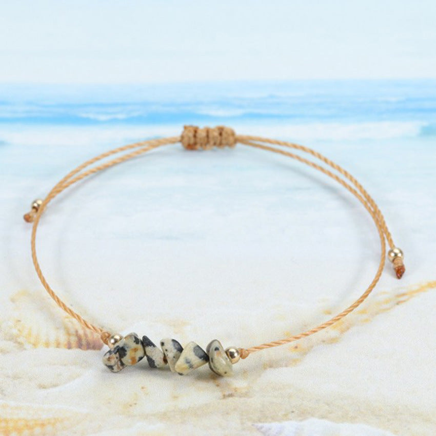 Elegant handcrafted bracelet displayed on a wooden surface