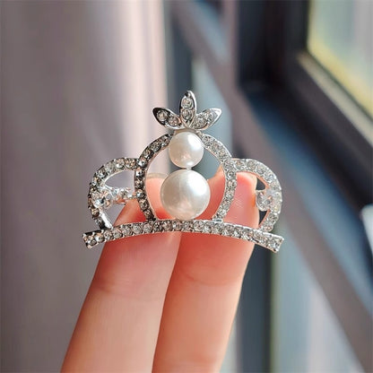 Detailed close-up of rhinestone crown pin