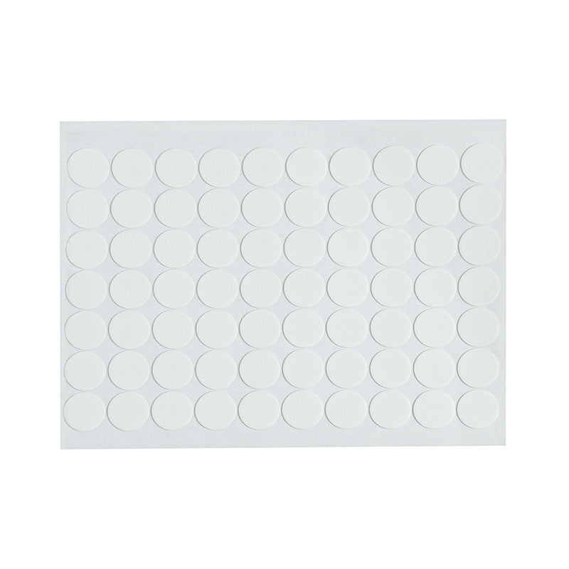 Multiple adhesive dots on a surface
