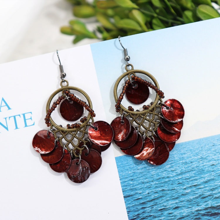 Casual outfit with shell earrings showcased