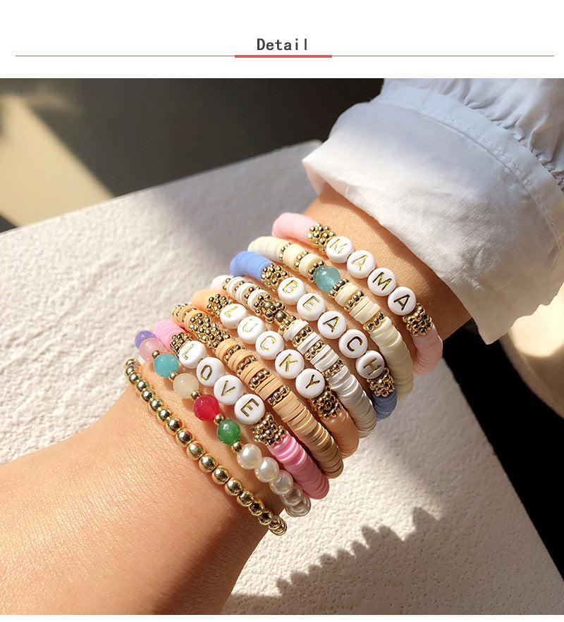 Various colors of polymer clay bracelets together - image 4