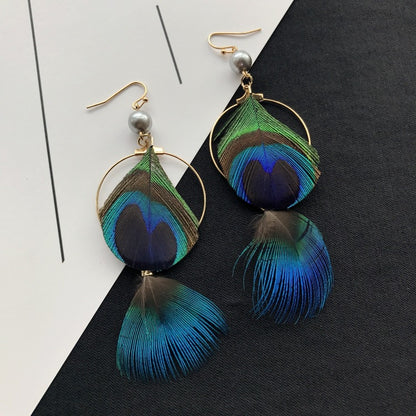 Bohemian Peacock Feather Tassel Earrings - Image 1