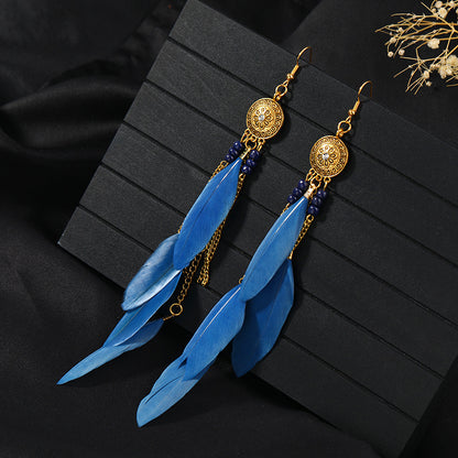 Stylish tassel earrings on model