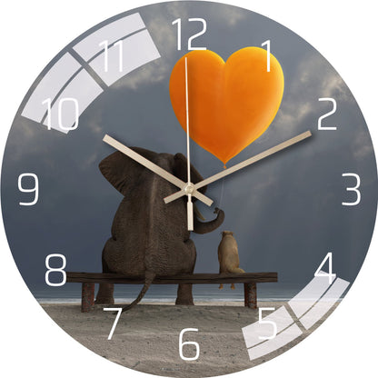 Stylish glass wall clock on the wall