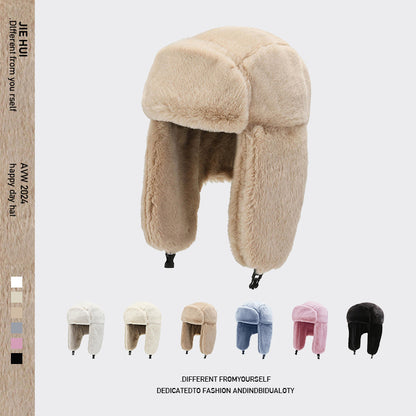 Stylish winter earflap hat on outdoor background