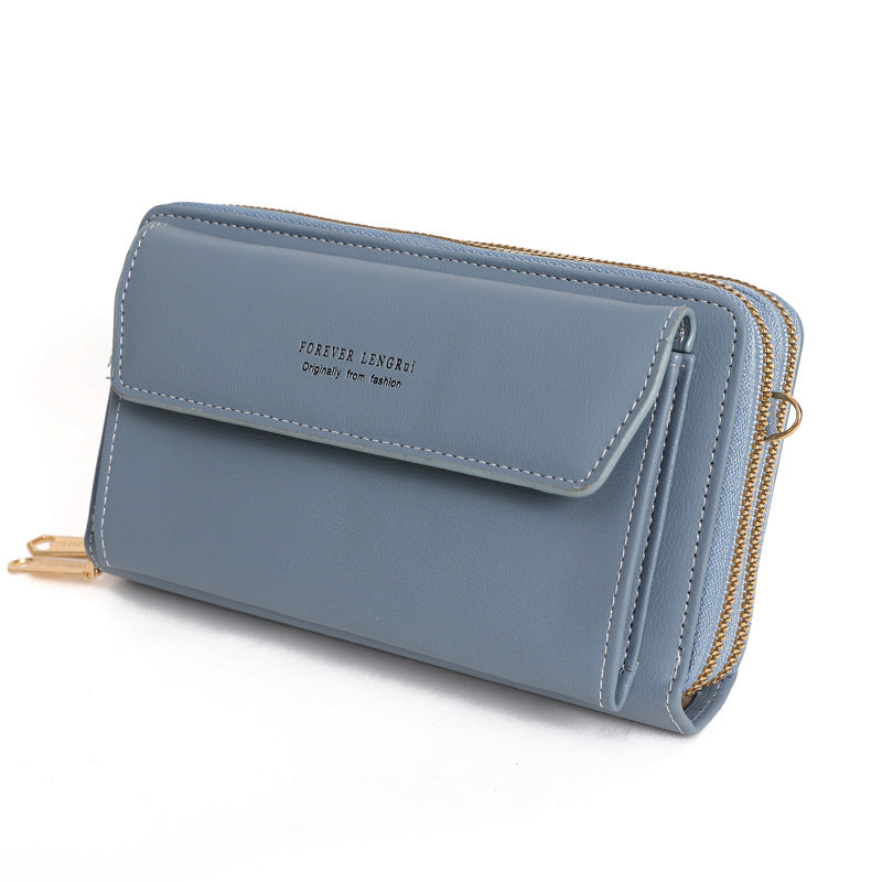 Black compact handbag featuring zipper closure