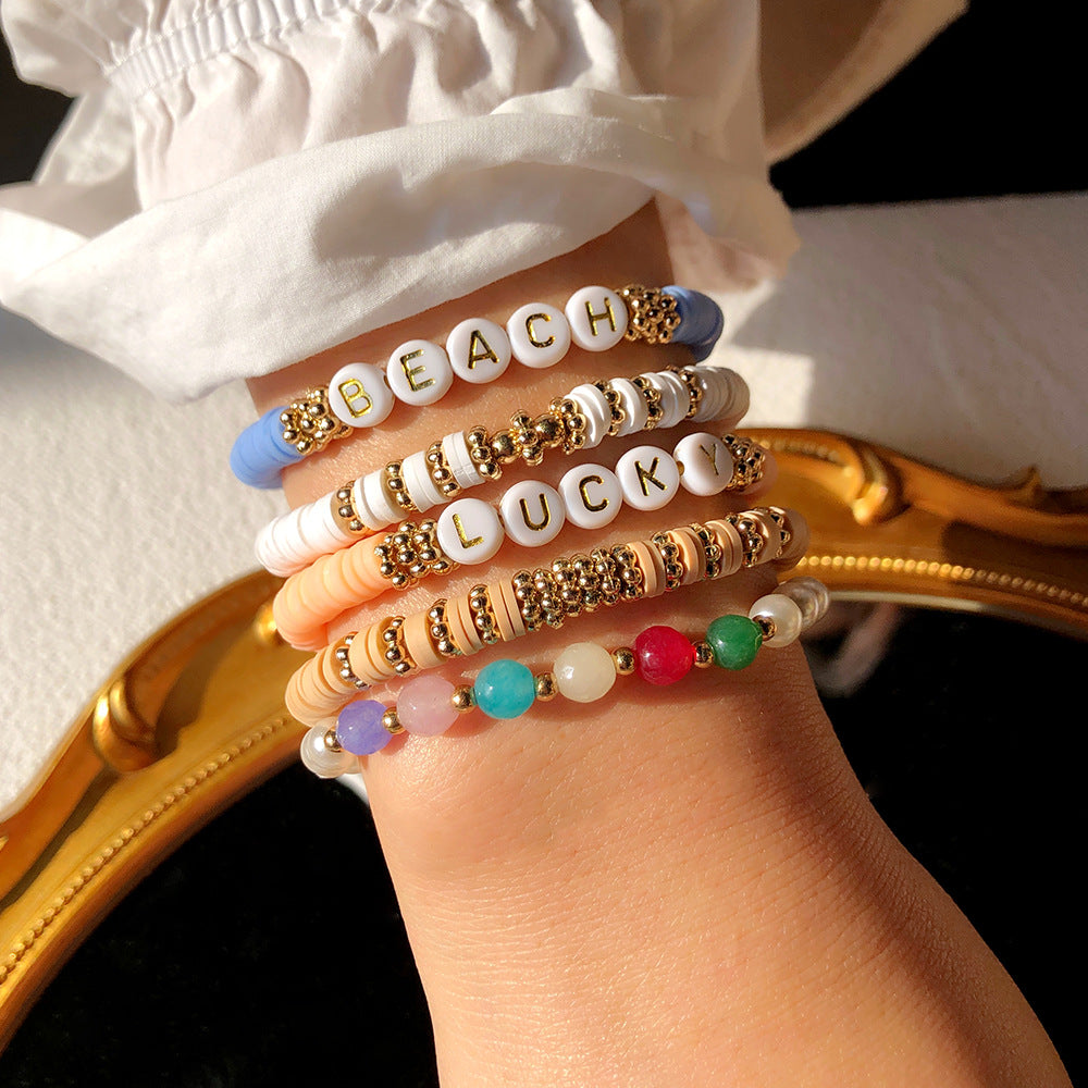 Various colors of polymer clay bracelets together - image 4