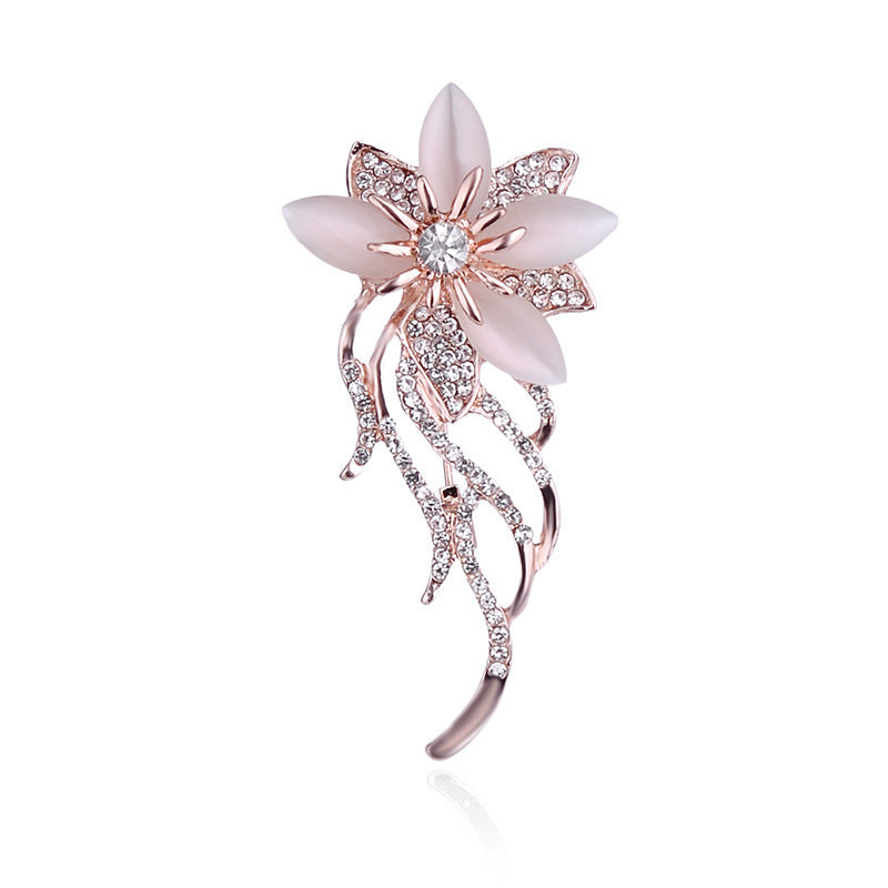 floral brooch with cat's eye stone