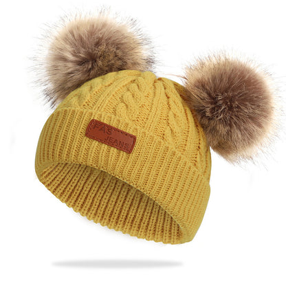 Colorful pom-pom knit hat for children